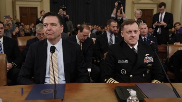 ames Comey, left, and Michael Rogers, right, await the beginning of a House Intelligence Committee
