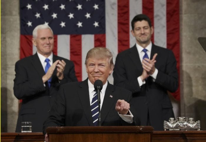 US Vice President Mike Pence (L) and Speaker of the House Paul Ryan (R) applaud as US President Donald J. Trump (C)REUTERS/Jim Lo Scalzo