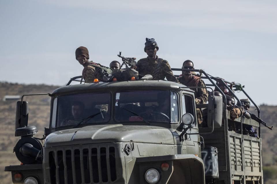 Ethiopian government soldiers ride in the back of a truck on a road near Agula, northern Ethiopia. Source: AP