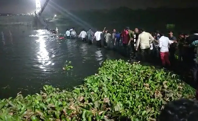 Over 100 people are feared to be trapped after a bridge collapsed in India
